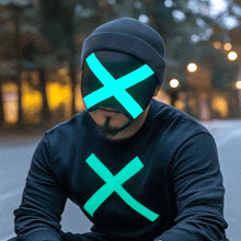 a man wearing a mask with a green cross on it