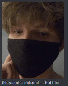 a picture of a person wearing a black face mask with the caption this is an older picture of me that i like