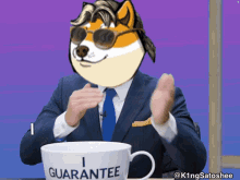 a man wearing a suit and tie is clapping next to a mug that says guarantee