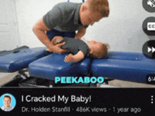 a video of a man holding a baby on a table with the caption i cracked my baby