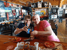 two women toasting in front of a sign that says flashback on it