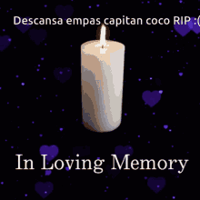 a candle with the words in loving memory on the bottom