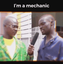 a man is holding a microphone and talking to another man with the words i 'm a mechanic on the bottom