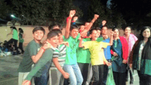 a group of children are posing for a picture and one of them is wearing a yellow shirt that says ' a '