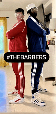 two men standing back to back with #thebarbers on the bottom right