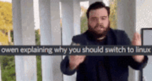 a man with a beard is explaining why you should switch to linux .