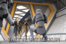 a group of stormtroopers are standing in a hallway with the words they 've got backup