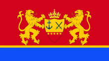 a red and blue flag with a coat of arms with two lions and a crown