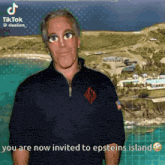 a man in a black shirt is standing in front of a beach and says " you are now invited to epsteins island