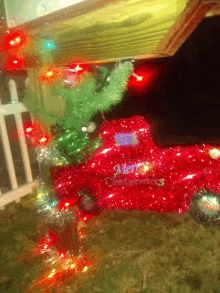 a red truck with merry christmas written on the side of it