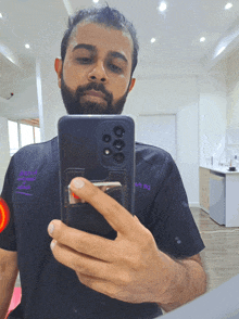 a man taking a picture of himself in a mirror with a phone that says astro on it