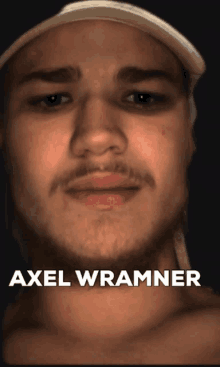 a close up of a man 's face with the name axel wrammer on the bottom