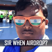 a man wearing sunglasses with the flag of india on them