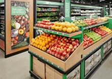 a grocery store display of fruits and vegetables with a sign that says fresh vegetables that change with the season