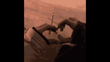 a person holding a cigarette in their hand with a lighter