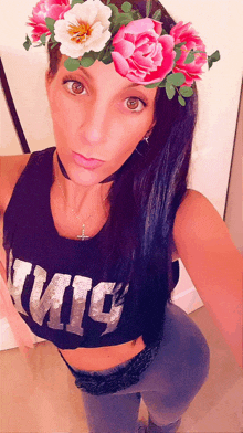 a woman wearing a flower crown and a shirt that says ' twig '