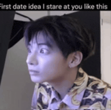 a close up of a man 's face with the words `` first date idea i stare at you like this '' above him .