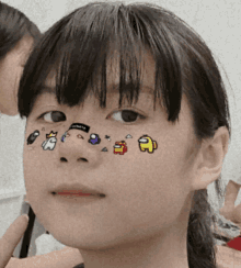 a girl has among us characters on her face