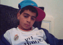 a young boy wearing a baseball cap and a jersey that says ' u17 ' on it