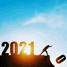 a silhouette of a man pushing the number 2021 on top of a hill .