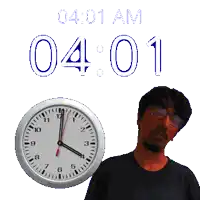 a man stands in front of a clock that says 04 01 am