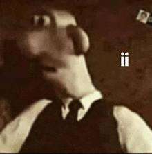 a cartoon character in a suit and tie says ii on the screen