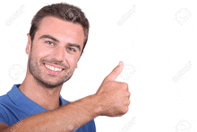 a man in a blue shirt is smiling and giving a thumbs up sign