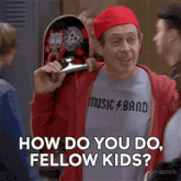 a man wearing a music band shirt is holding a skateboard over his shoulder and says " how do you do fellow kids "