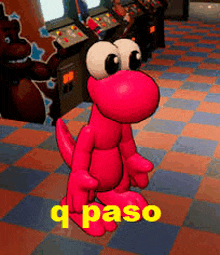 a pink cartoon dinosaur is standing on a checkered floor in an arcade with the words q paso below it .