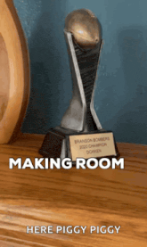 a trophy that says making room is on a table