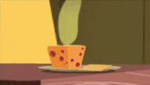 a piece of cheese is on a plate next to a piece of crackers