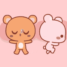 a brown teddy bear and a pink bunny are standing next to each other