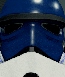 a close up of a blue helmet with a white mask on it