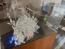 a display case with a sculpture of crystals on it