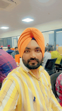 a man wearing a turban and a polo shirt