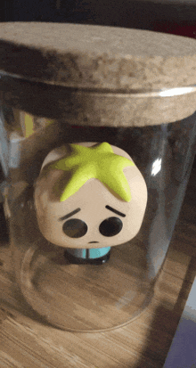 a funko pop figure with a yellow star on his head