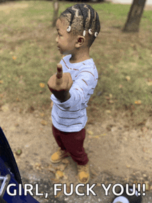 a little girl giving the middle finger with the words girl fuck you behind her