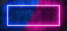 a blue and pink neon frame on a wooden background .