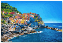 a painting of a small town on a rocky cliff overlooking the ocean