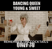 a woman in a white jacket is holding a glass of red wine and dancing