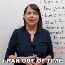 a woman stands in front of a white board with the words i ran out of time written on it