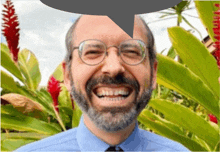 a man with glasses and a beard is laughing with a speech bubble above his head