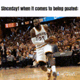 a basketball player with the number 23 on his jersey dribbles the ball