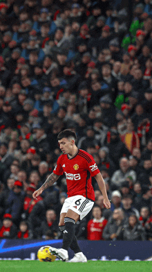 a soccer player in a red jersey with the number 6 on it