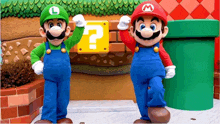 mario and luigi standing next to each other with a question mark in the background