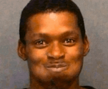 a close up of a man 's face with a funny face .
