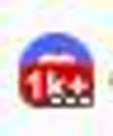 a blurred image of a red and blue circle with a number 1 on it on a white background .