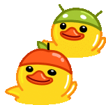 two rubber ducks wearing apple hats are sitting next to each other .