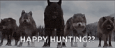 a group of wolves standing in the snow with the words `` happy hunting '' written on the bottom .