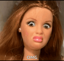 a barbie doll with a surprised look on her face and the words omg written below her
